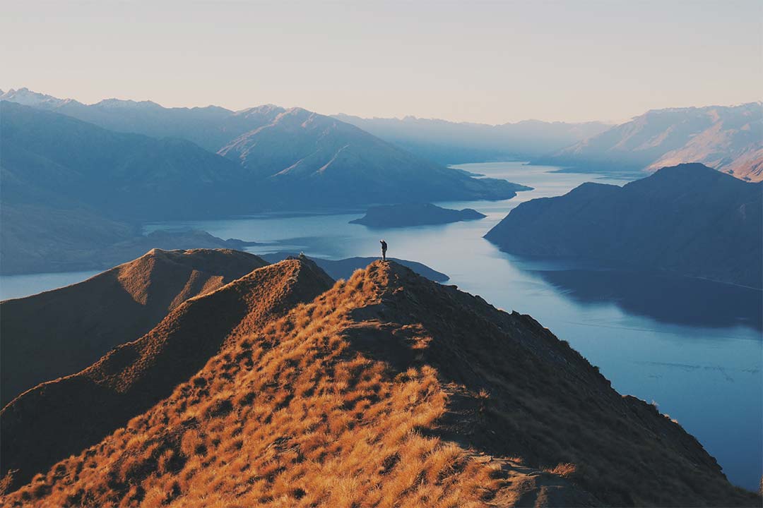 Hiker on mountain enjoying the view
